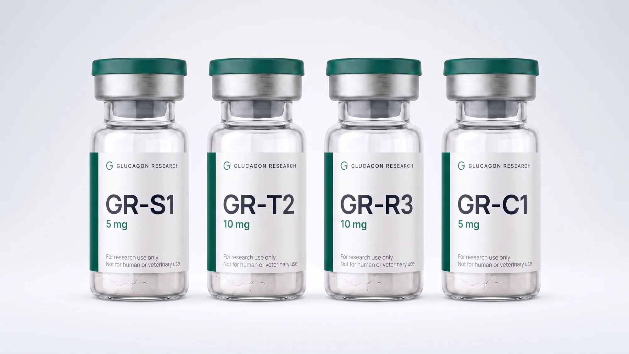 Four sealed Glucagon Research vials standing in a row on white