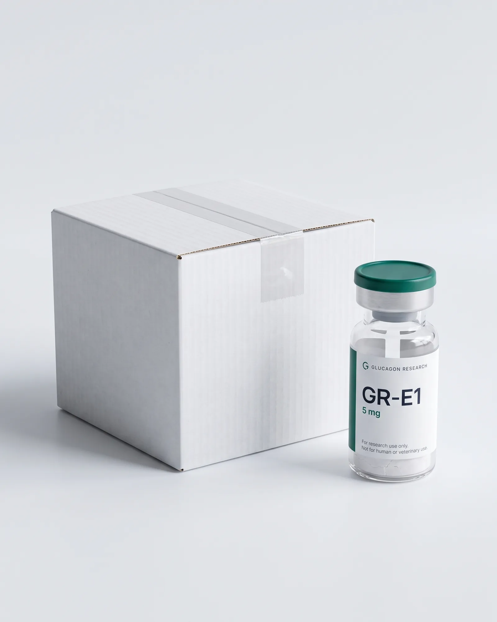 A plain white shipping box with a sealed Glucagon Research vial beside it
