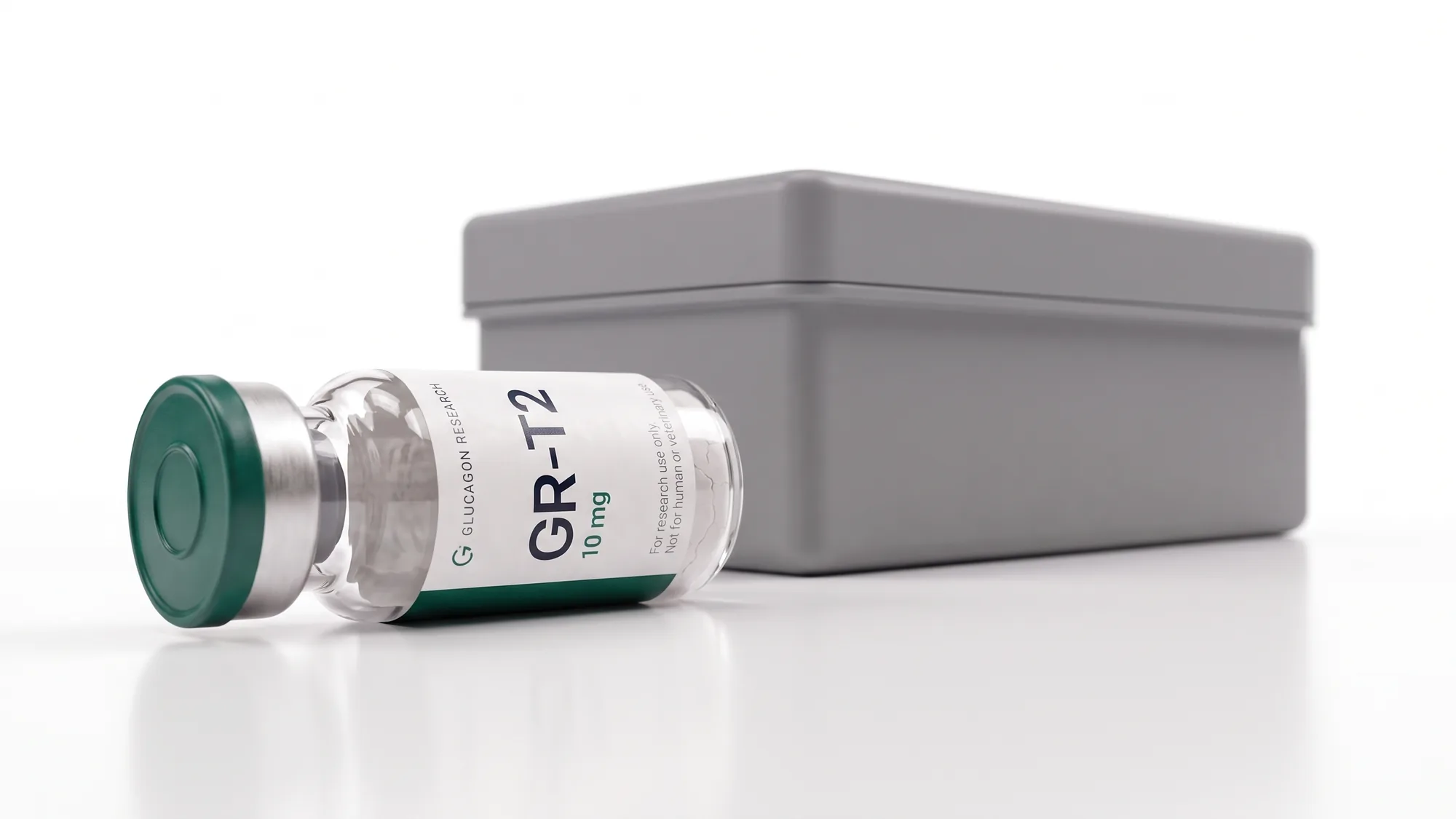 A sealed Glucagon Research vial lying beside a grey lidded sample box
